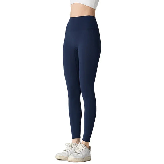 Navy blue leggings worn by a person on a white background