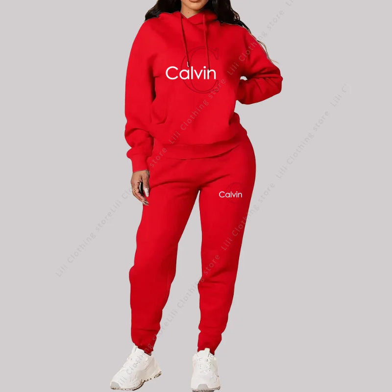 Red Calvin tracksuit worn by a person on a gray background