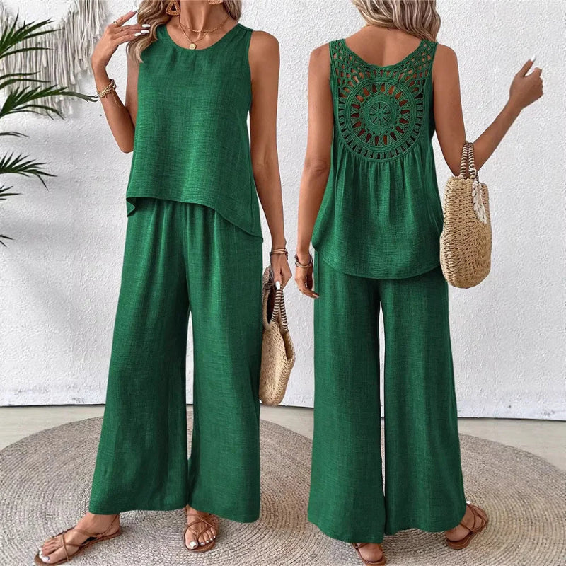 Green sleeveless top and wide-leg pants worn by a model, with a white background.