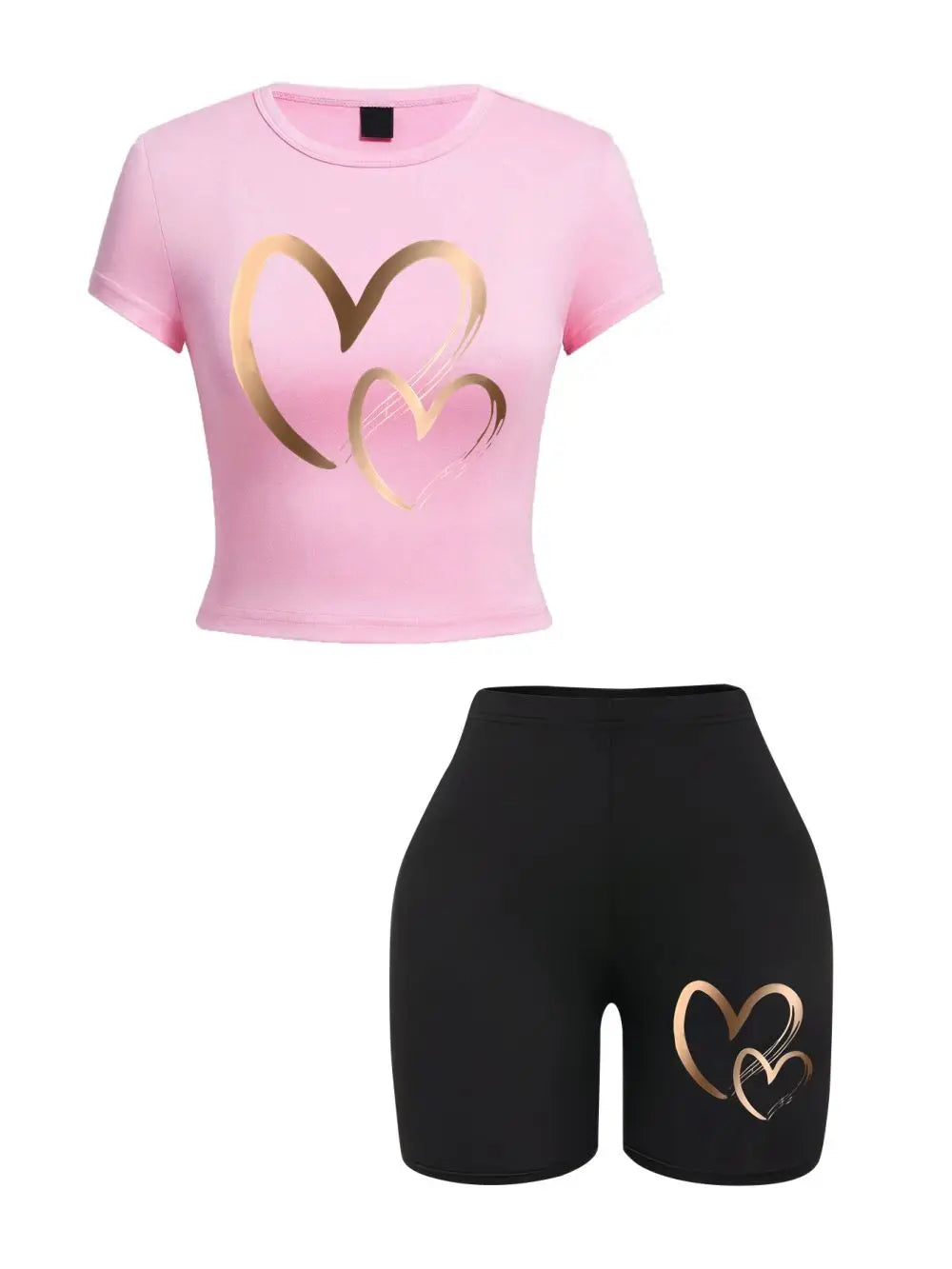 Pink crop top with gold heart design and black shorts with gold heart design on a white background