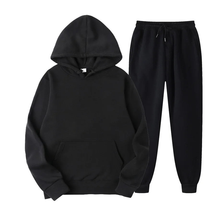Black hoodie and black pants on a white background