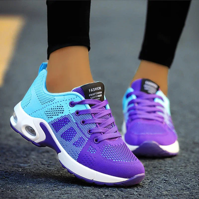 Blue and purple running shoes on a blurred street background
