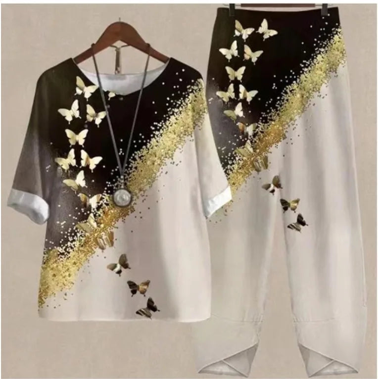 Black and white outfit with butterfly design on a hanger against a beige background