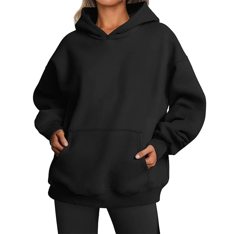 Black hoodie worn by a person on a white background