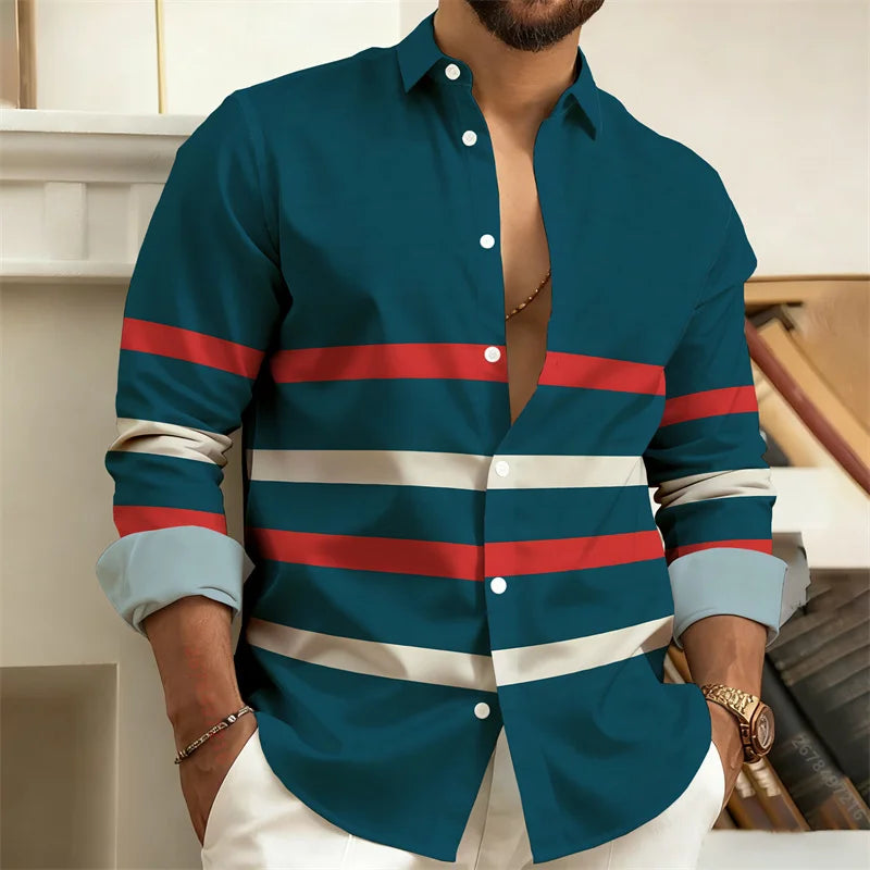 Man wearing a blue shirt with red and white stripes, sitting on a couch.