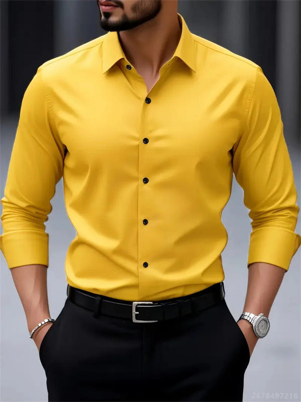 Yellow dress shirt with black buttons worn by a person on a gray background