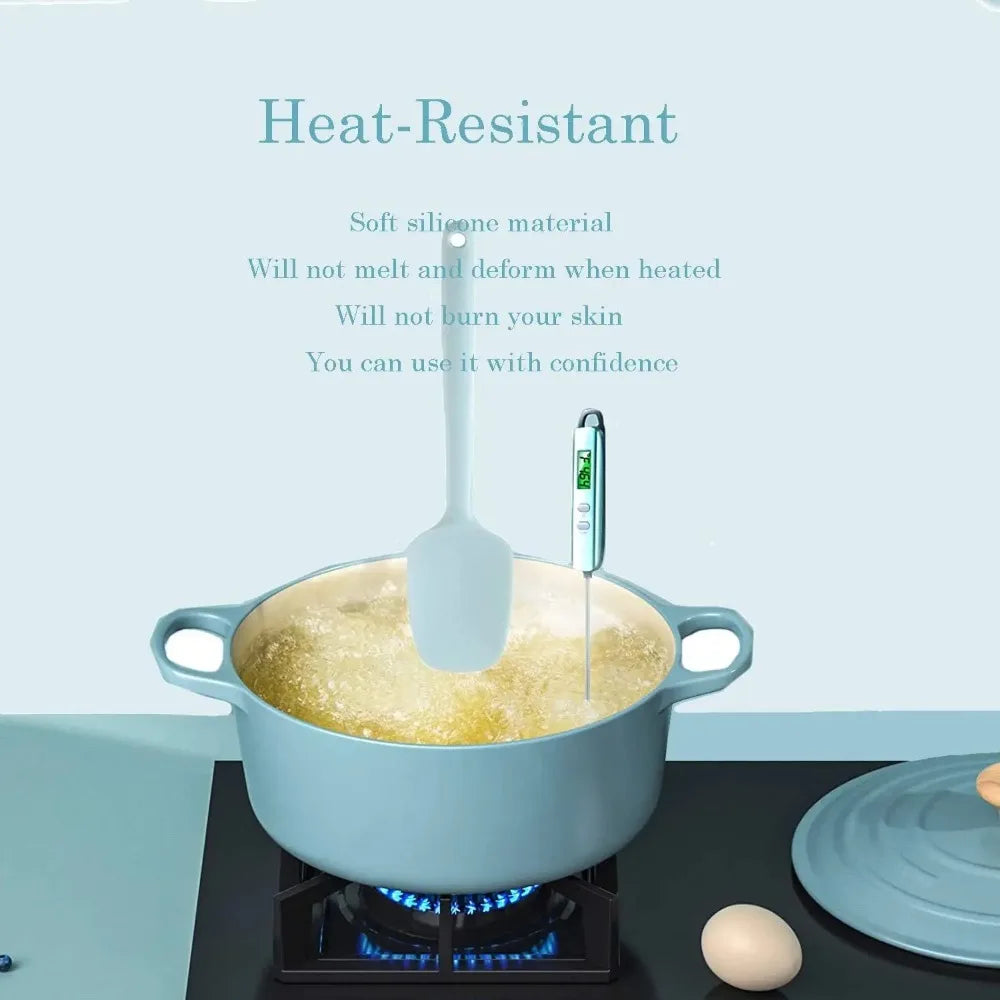 Blue pot on a stove with a spatula and thermometer, featuring text about heat-resistant material.