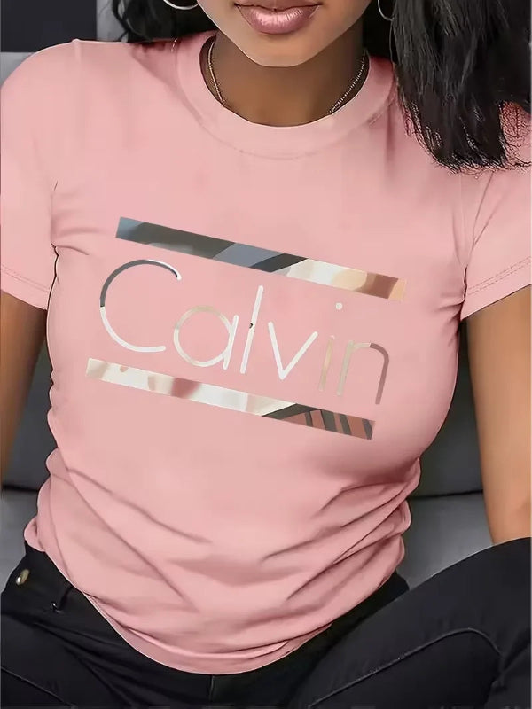 Person wearing a pink Calvin Klein t-shirt with metallic logo.