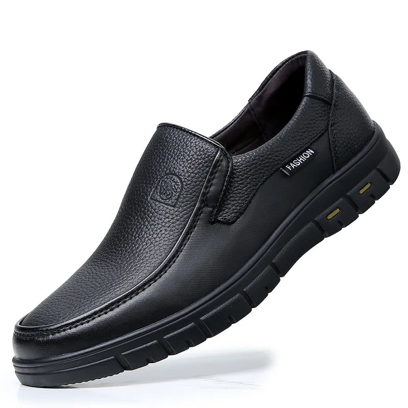 Black leather shoe on a white background