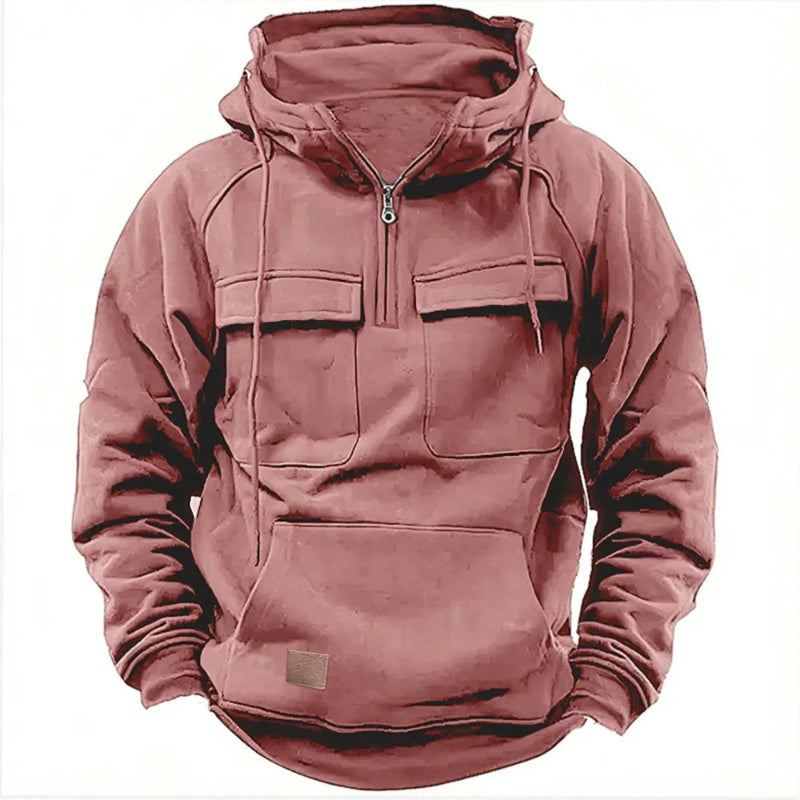 Pink hoodie with front pockets and a zipper on a white background