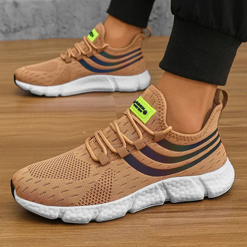 Brown running shoes with white soles on a wooden floor