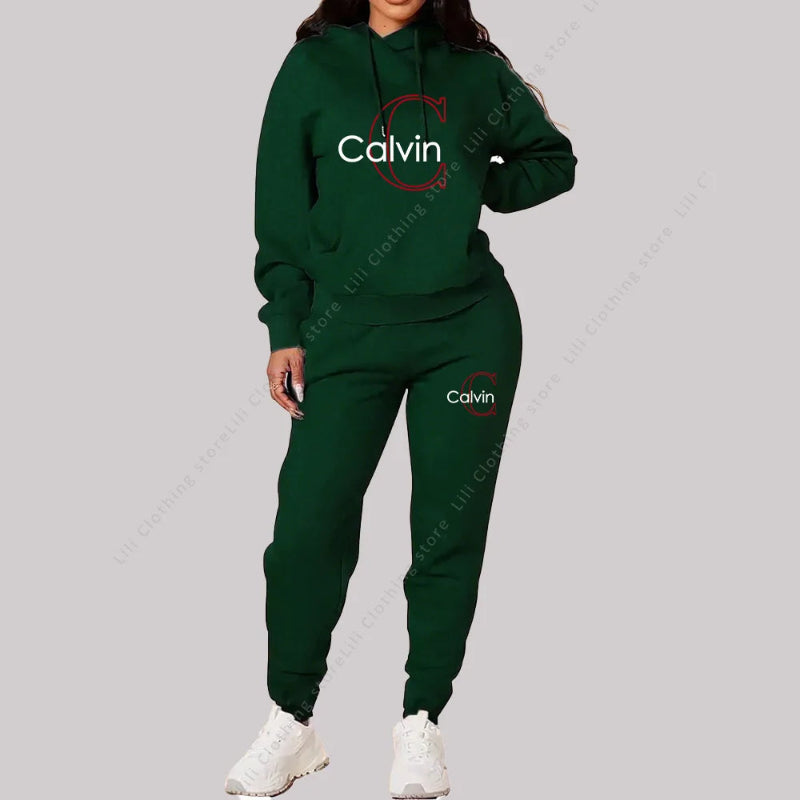 Green Calvin tracksuit worn by a person on a gray background