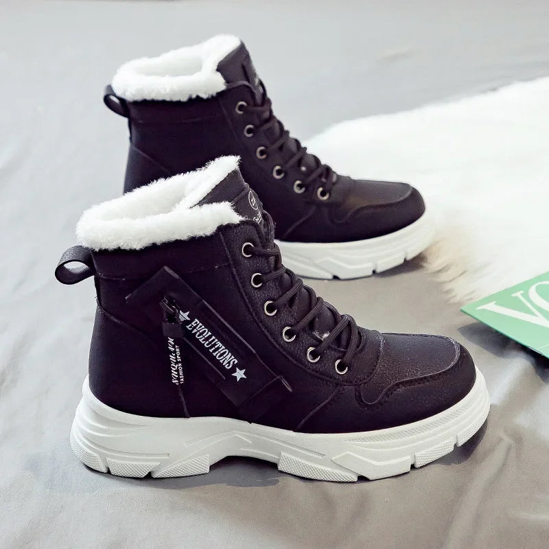 Pair of dark purple winter boots with white fur lining on a light gray background