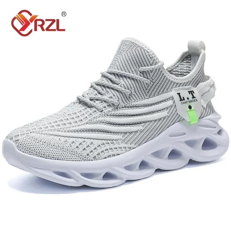 A pair of YRZL branded black sports running shoes with mesh upper material and a rubber outsole, displayed against a cardboard background.