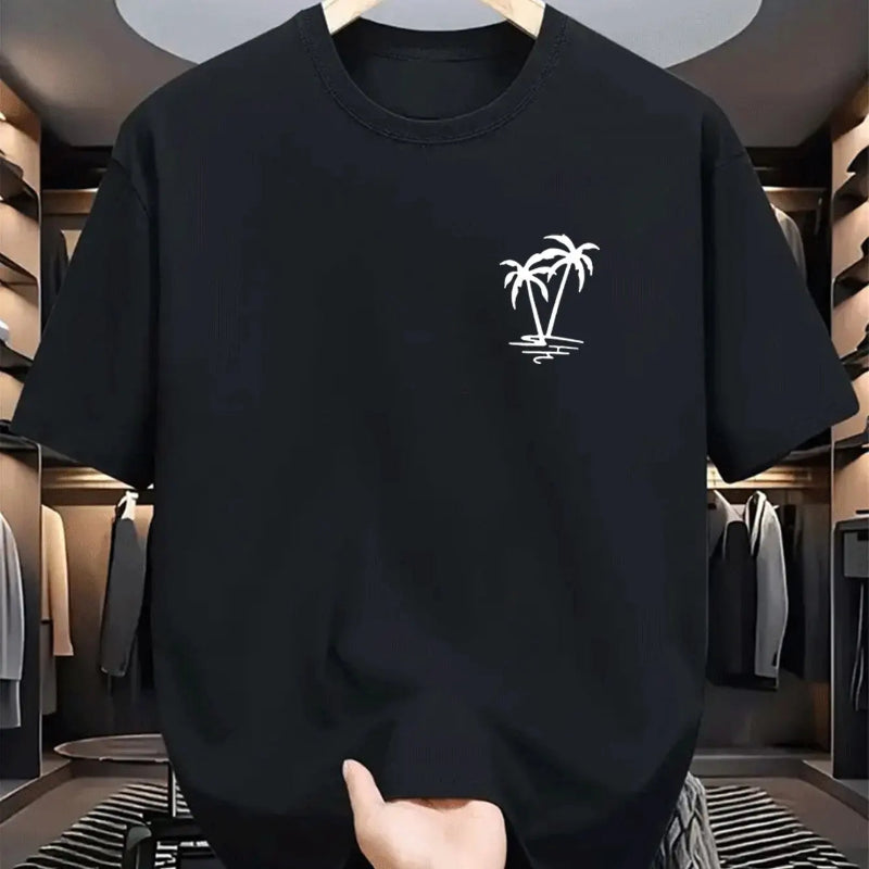 Black sweatshirt with a palm tree design held in a clothing store.