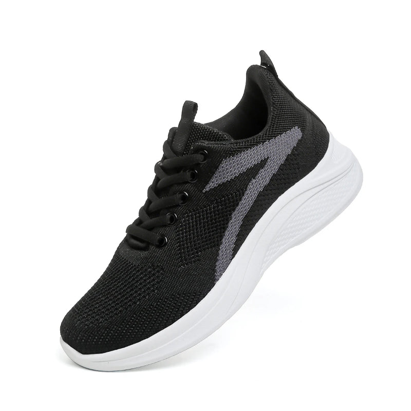 Black athletic shoe with white sole on a white background