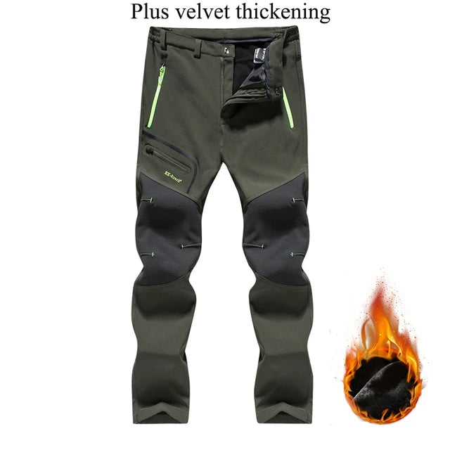 Green and black pants with flame graphic on a white background