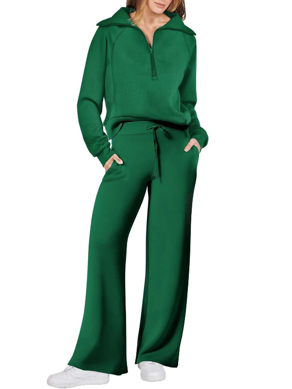 Green tracksuit worn by a person on a white background