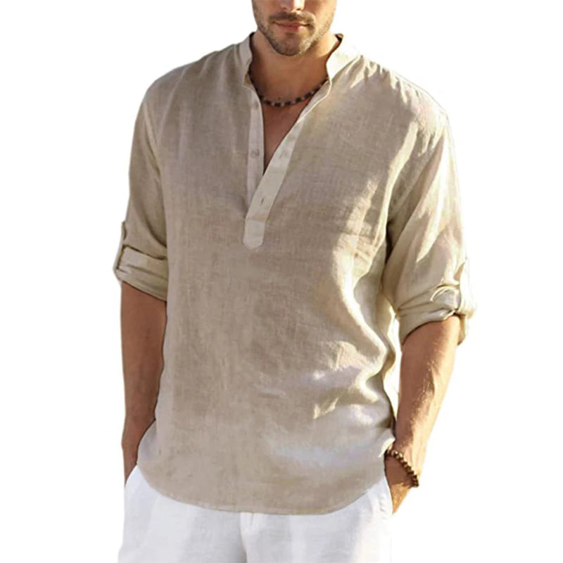 Man wearing a beige linen shirt with rolled-up sleeves on a white background