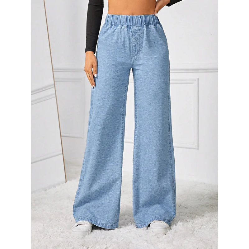 Light blue wide-leg jeans worn by a person on a white background