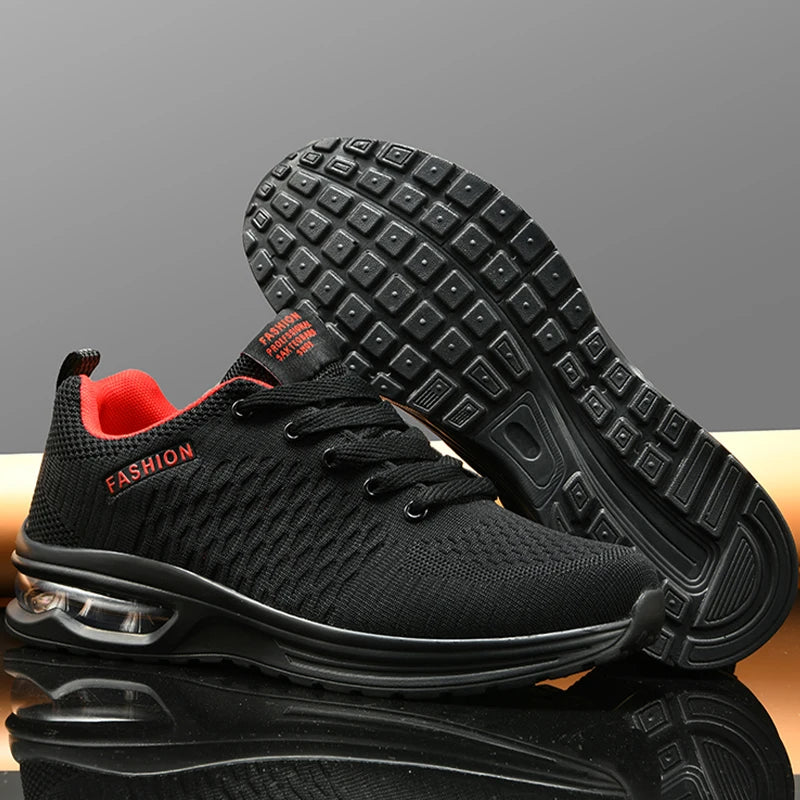 Black sneakers with red interior on a reflective surface and gray background