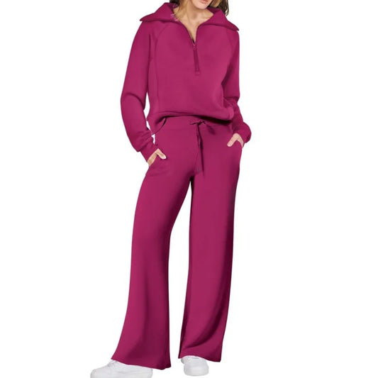 Person wearing a magenta tracksuit on a white background