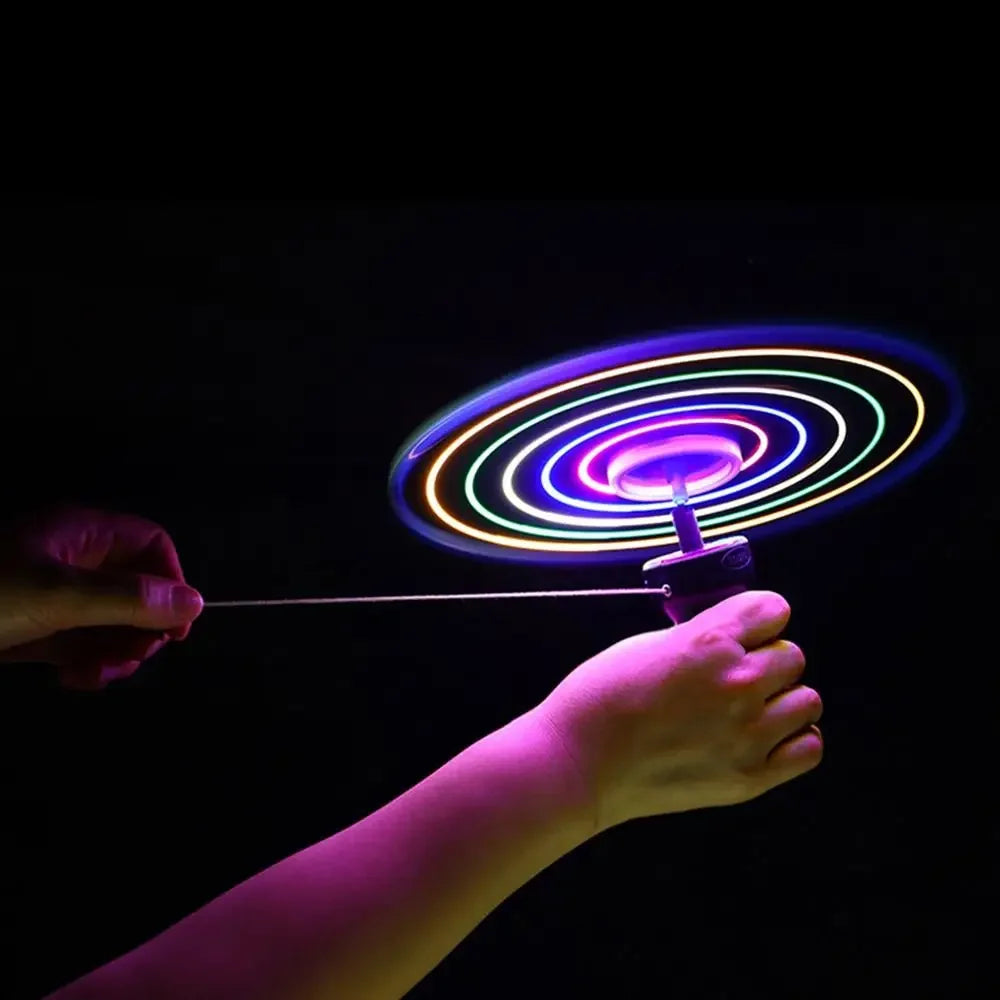 Colorful LED spinner being spun against a dark background