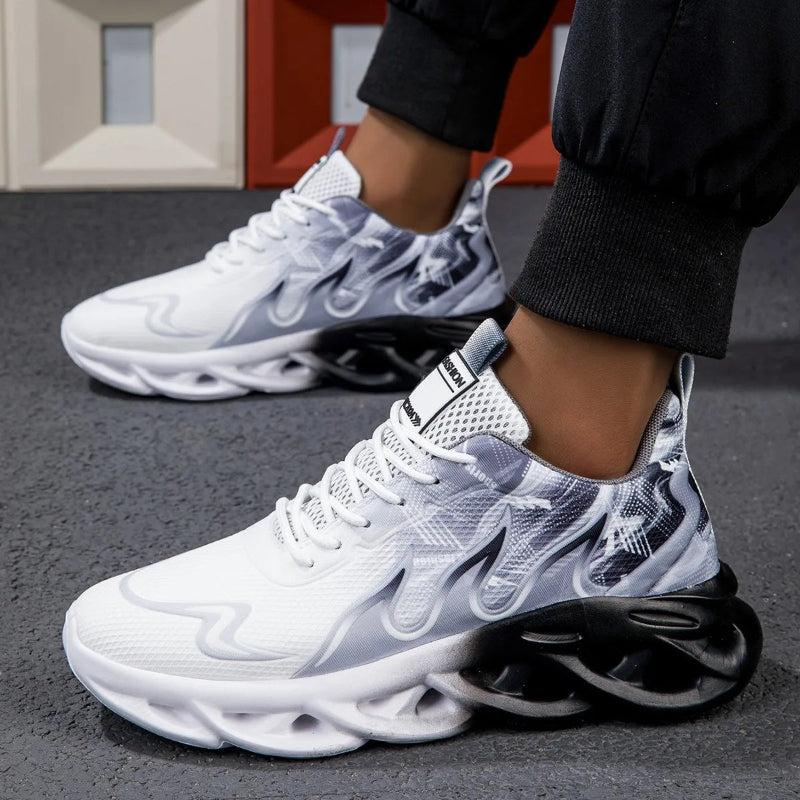 White and gray sneakers with a unique sole design on a dark surface.