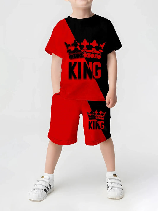 A child wearing a red and black outfit with a 3D crown print.