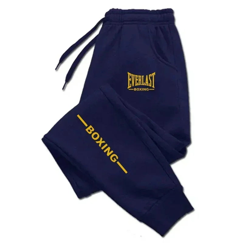 Navy blue tracksuit with yellow 'Everlast Boxing' text on a white background