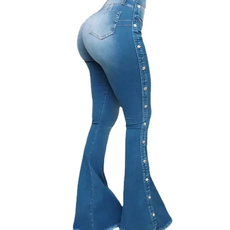 Blue bell-bottom jeans with button details on a white background