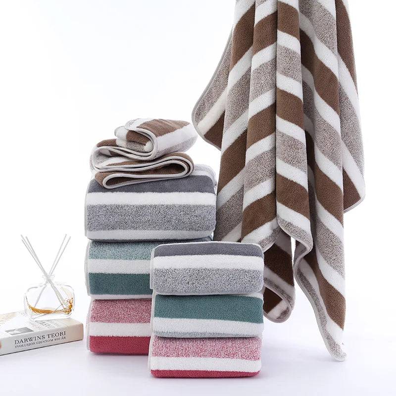Stack of striped towels in various colors on a white background