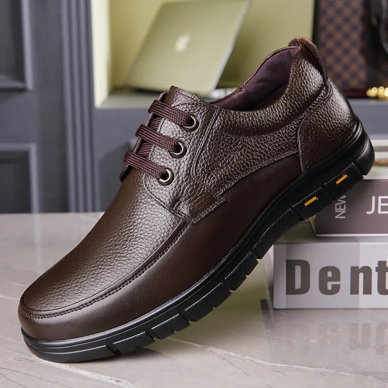 Brown leather shoe on a surface with a blurred background