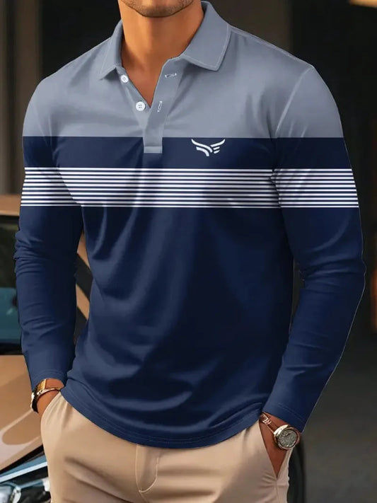 Man wearing a blue and gray long-sleeve polo shirt with a logo, standing next to a car.