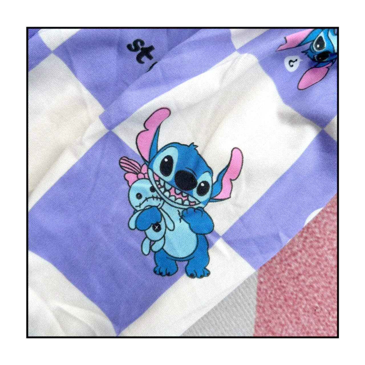 Fabric with cartoon character design on a checkered background