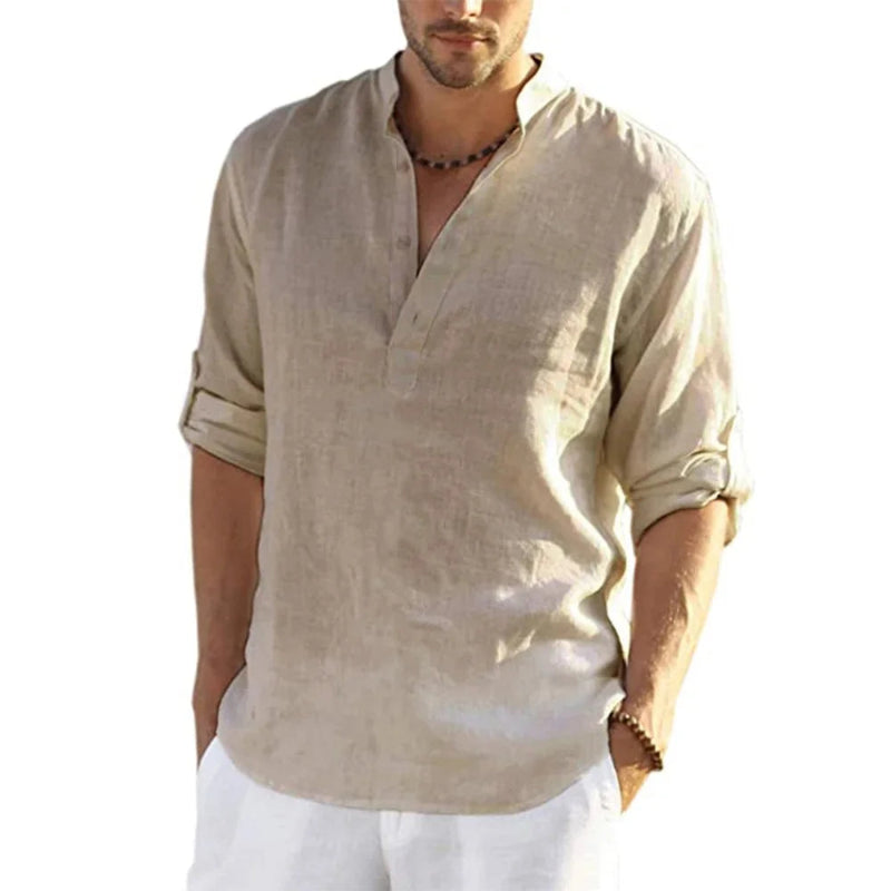 Man wearing a beige linen shirt with rolled-up sleeves on a white background