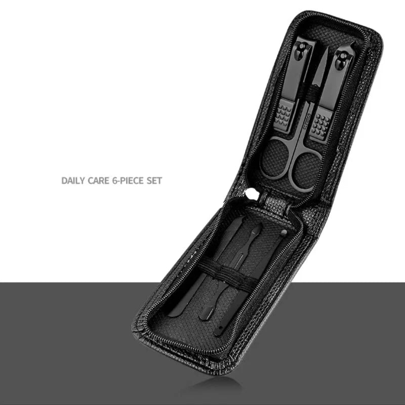 Black nail care set with tools in a case on a white background