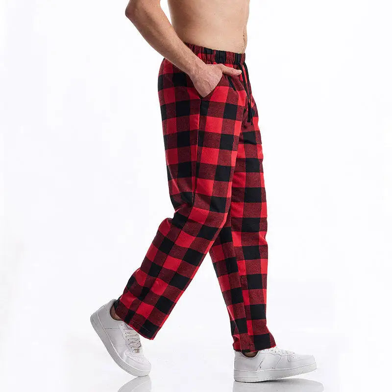 Red and black checkered flannel pants worn by a person on a white background