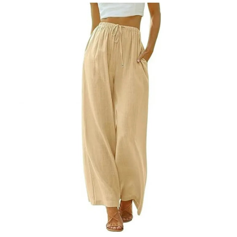 Beige wide-leg pants worn by a person on a white background