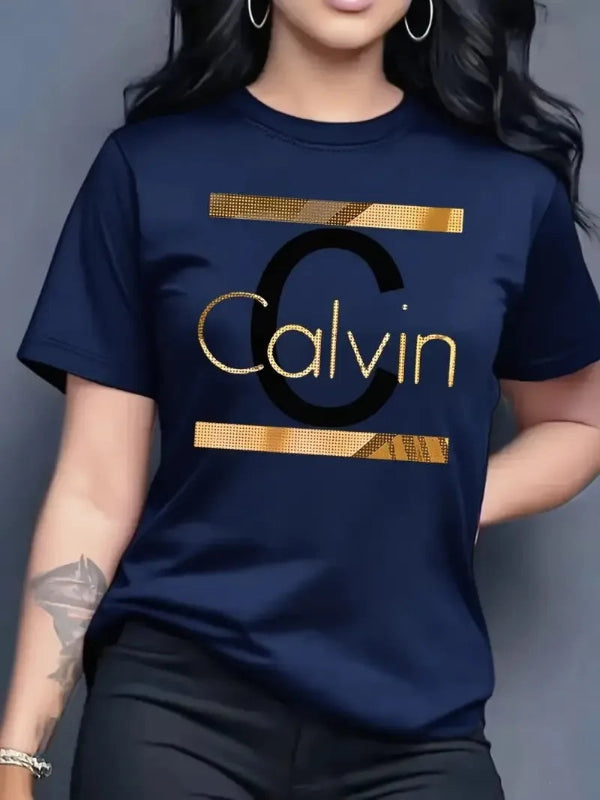 Person wearing a navy blue t-shirt with gold 'Calvin' logo on a gray background