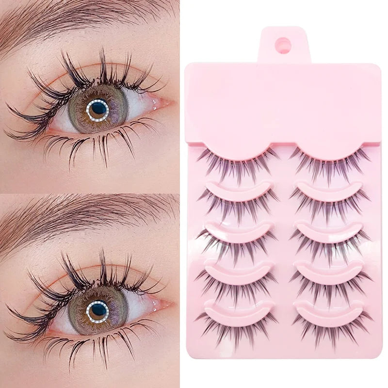 False eyelashes on eyes with a pink packaging tray displaying multiple pairs.