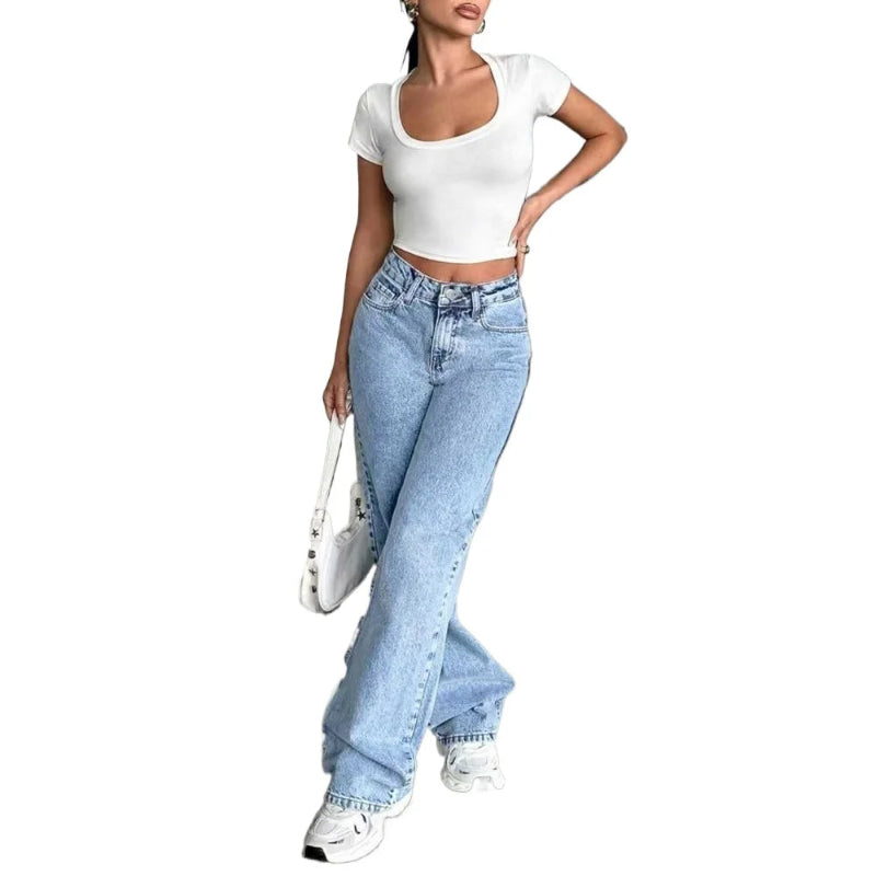 Person wearing a white crop top and light blue jeans on a white background