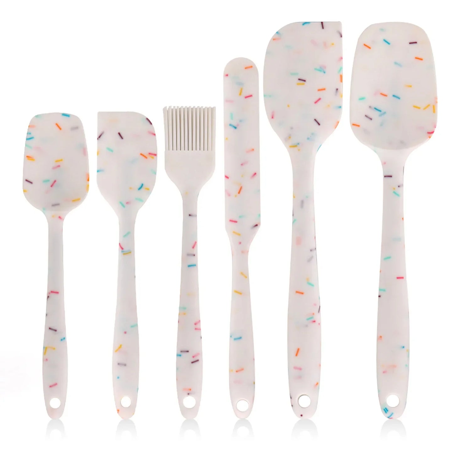 Set of five kitchen utensils with colorful sprinkles on a white background