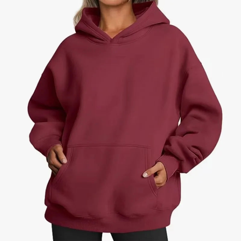 Maroon hoodie worn by a person on a white background