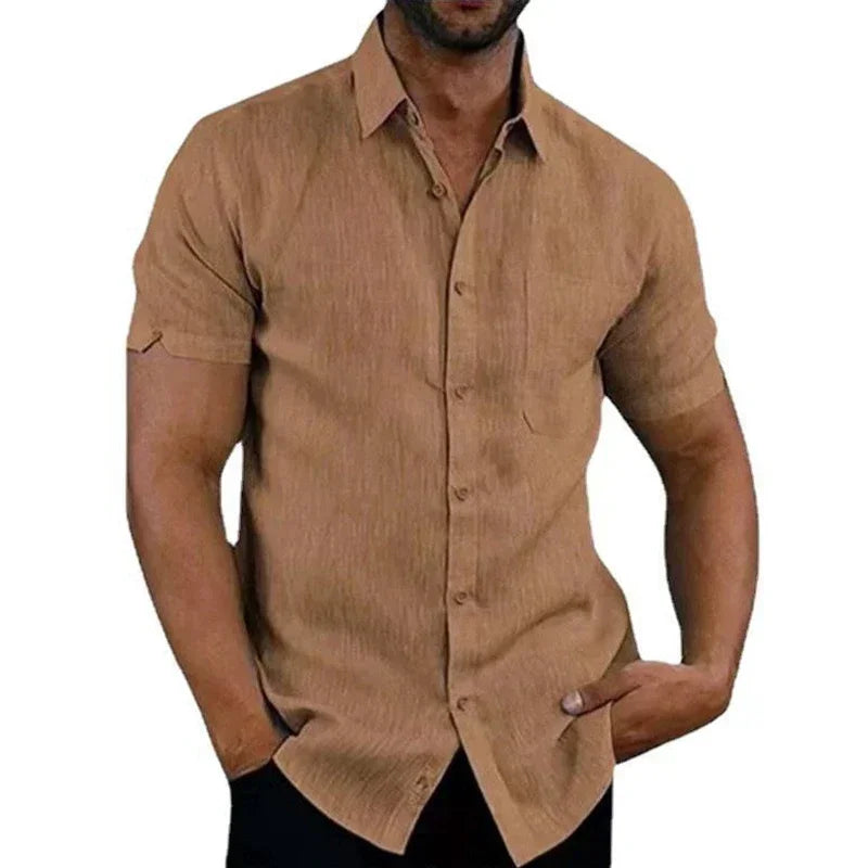 Man wearing a beige short-sleeve shirt on a white background