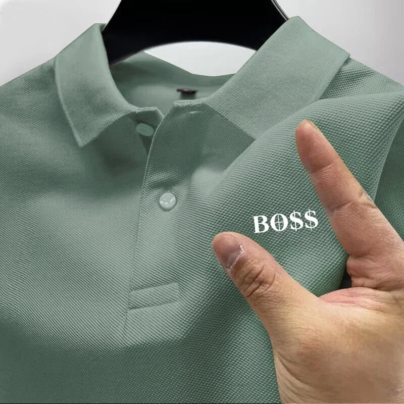 Green polo shirt with 'BOSS' text on a hanger