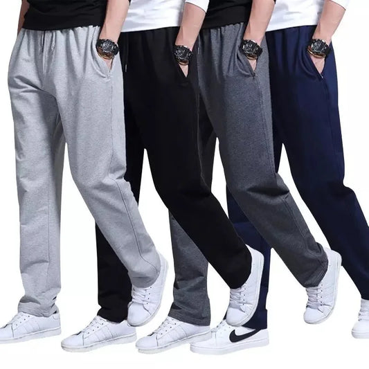Four pairs of pants in gray, black, and blue worn by people on a white background.