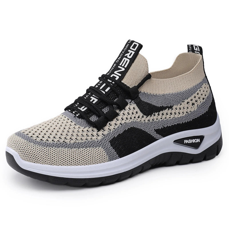 Beige and gray sneaker with black accents on a light gray background