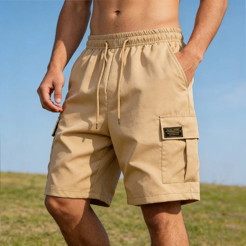 Beige shorts worn by a person with a clear blue sky background