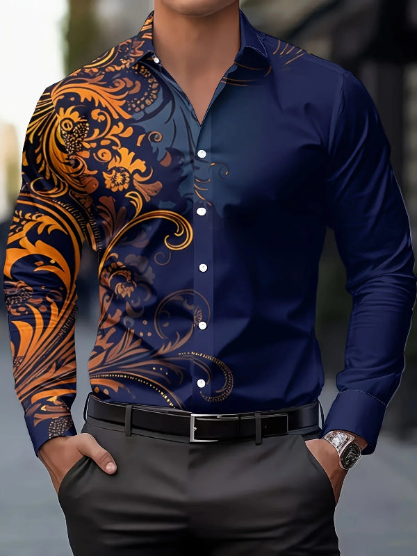 Man wearing a blue shirt with orange and black patterned sleeves and black pants.